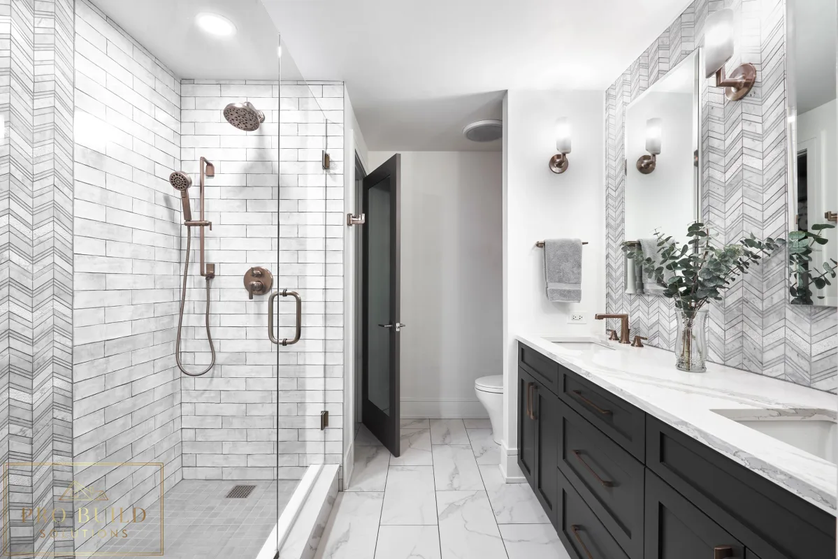Stylish transitional bathroom design featuring black cabinetry, patterned wall tile, and a frameless walk-in shower, Riverside