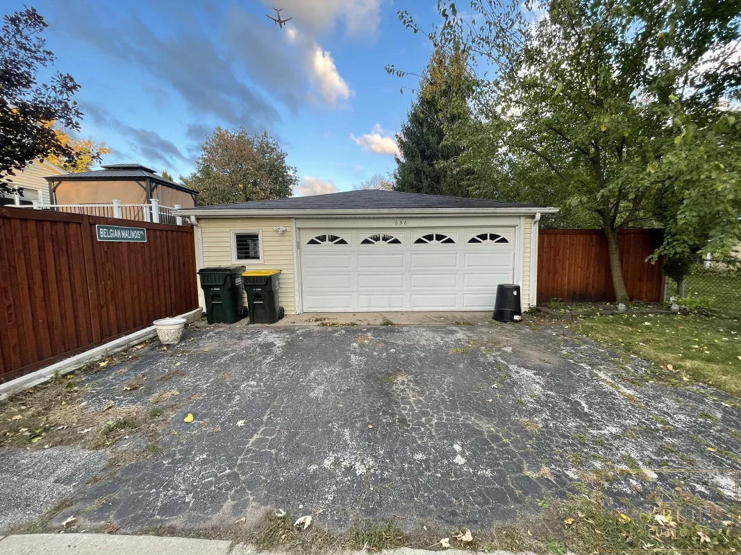Detached garage rebuild before photo with old driveway and existing garage, Wood Dale