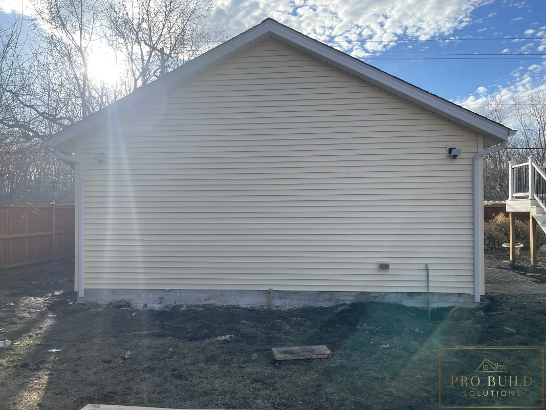 Finished garage exterior with new gutters, siding, and lighting, Wood Dale, IL