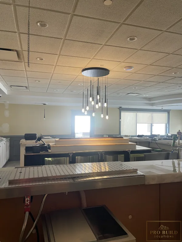 Decorative bar pendant lighting installed during commercial electrical upgrade, Schaumburg, IL