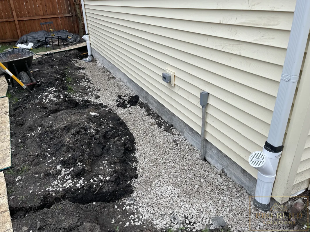 Garage foundation drainage system with gravel and French drain installation, Wood Dale, IL