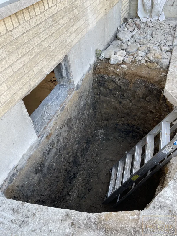Egress  window depth to the bottom of the foundation to setup for proper drainage., Elmhurst, IL