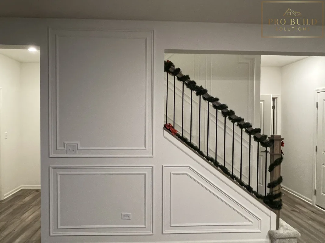 Custom interior trim work with picture frame wall molding and clean white finish, Plainfield, IL