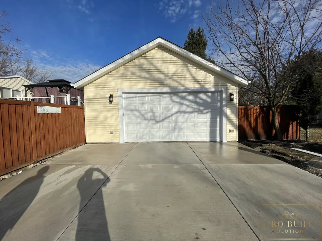 Detached garage rebuild after photo with new foundation, siding, and driveway, Wood Dale
