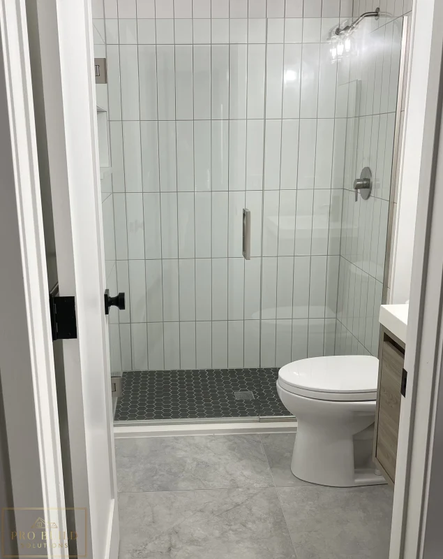 Updated bathroom design with walk-in shower, modern tile work, and clean neutral finishes, Claredon Hills