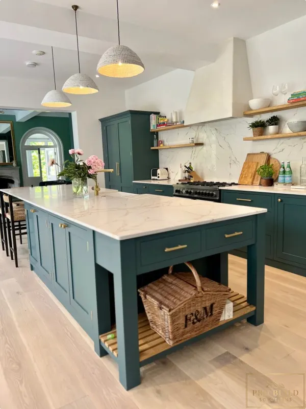 Elegant classic kitchen featuring teal cabinets, statement island, warm wood details, and light natural flooring, Lombard