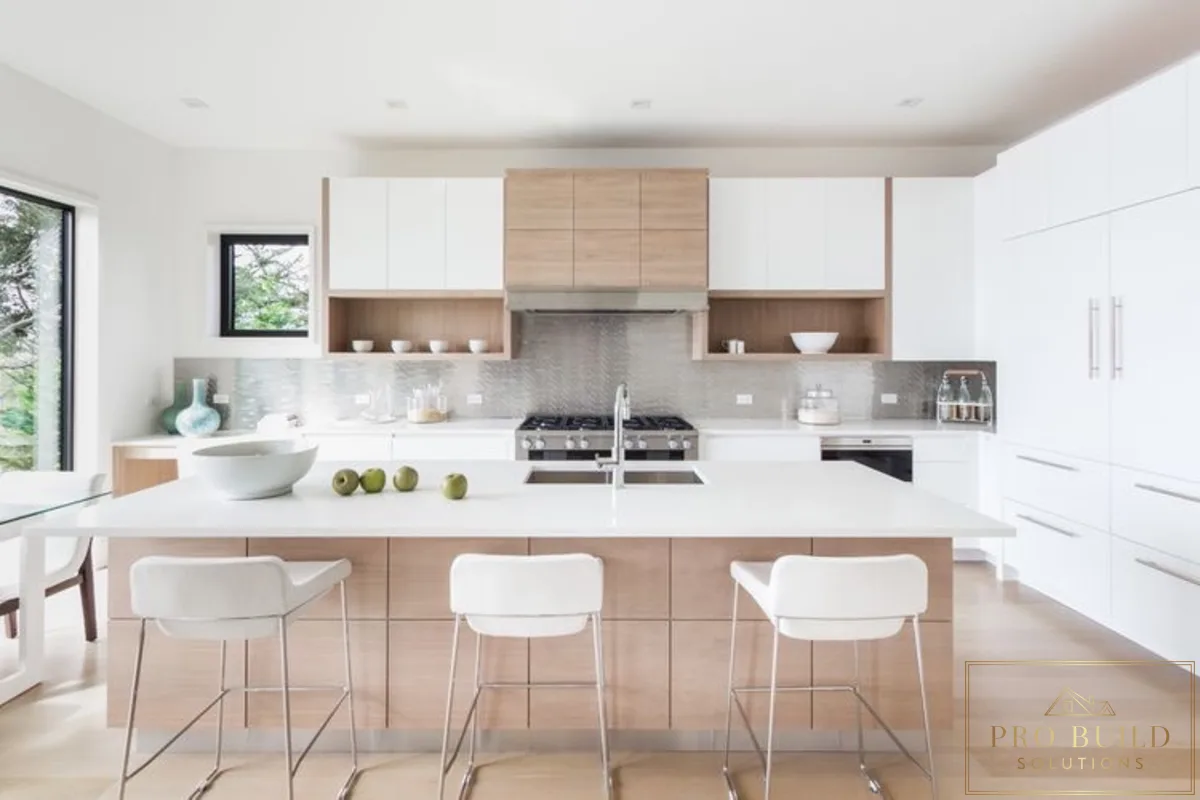 Contemporary modern kitchen featuring mixed white and natural wood cabinetry, oversized island sink, and clean linear design, Burr Ridge, IL