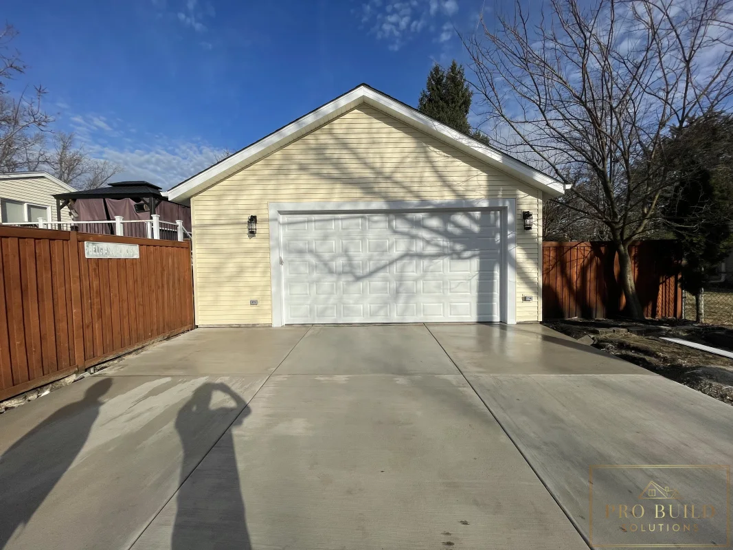 Detached garage rebuild after photo with new foundation, siding, and driveway, Wood Dale