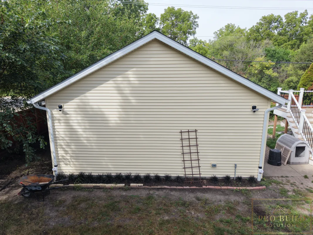 Finished garage exterior with new gutters, siding, and lighting, Wood Dale, IL
