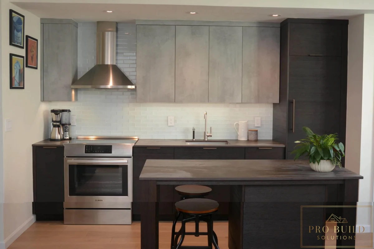 Modern kitchen with dark lower cabinets, light gray upper cabinets, white subway tile backsplash, and minimalist island seating, Downers Grove