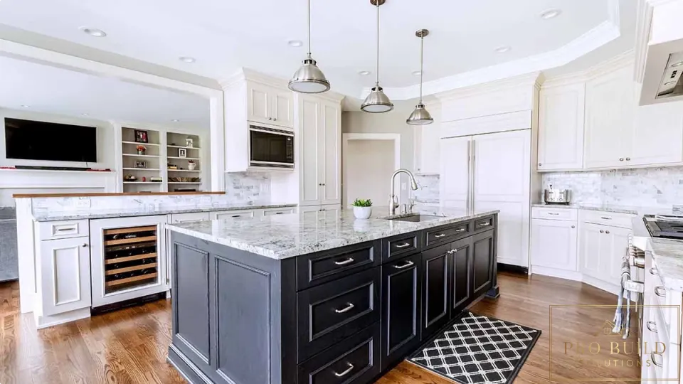 Traditional white kitchen with dark wood island, marble countertops, custom cabinetry, and built-in wine storage, Arlington Heights