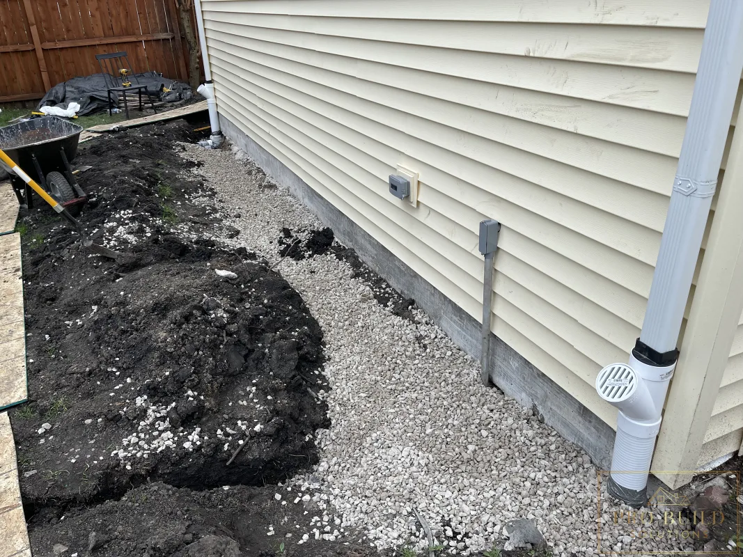 Garage foundation drainage system with gravel and French drain installation, Wood Dale, IL