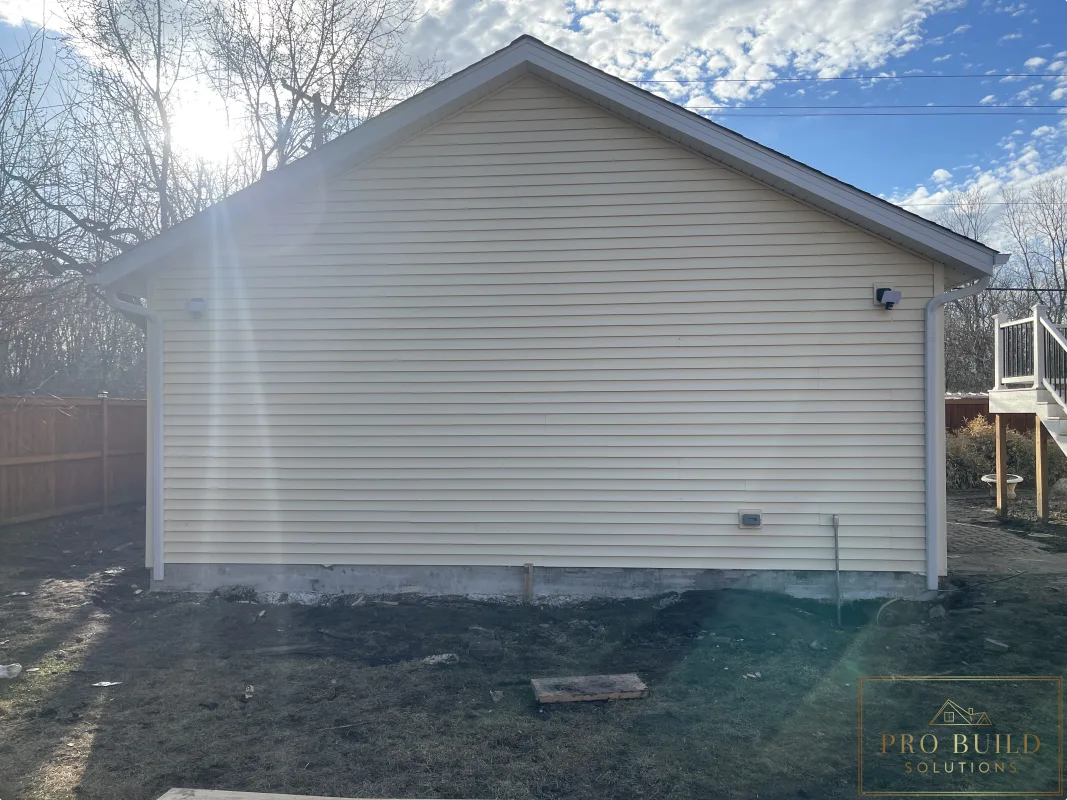 Finished garage exterior with new gutters, siding, and lighting, Wood Dale, IL