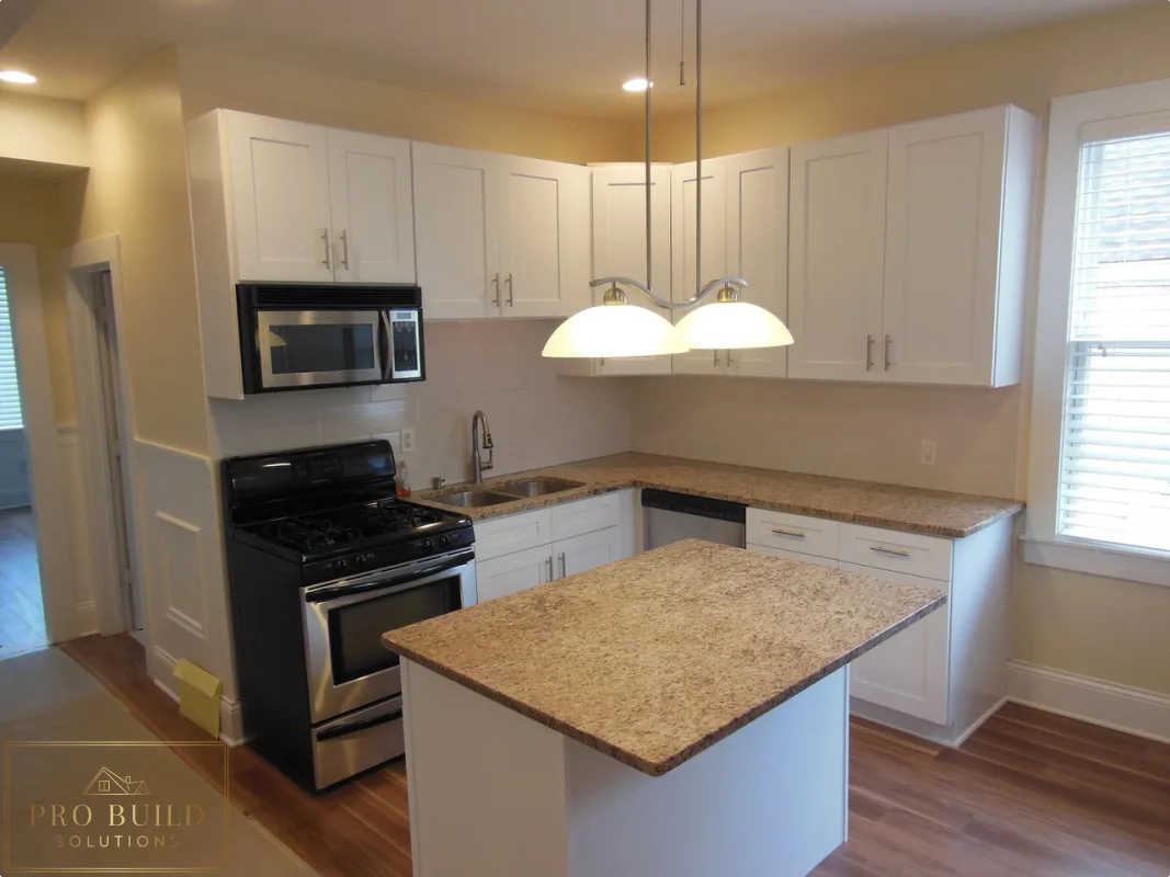 White shaker kitchen remodel with center island, granite countertops, and stainless steel appliances, Lombard, IL