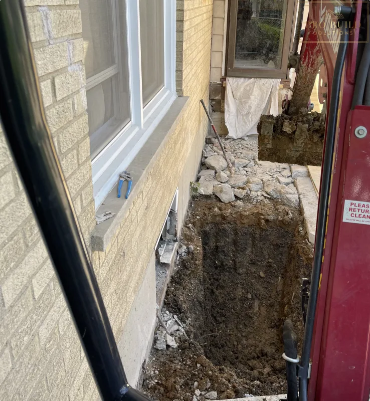 Egress Window area being dug out with excavator, Elmhurst, IL
