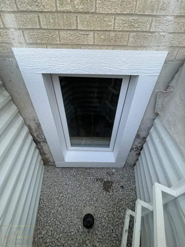 24"w * 48"h Window with White LP Trimming in the Egress Window Well, Elmhurst, IL