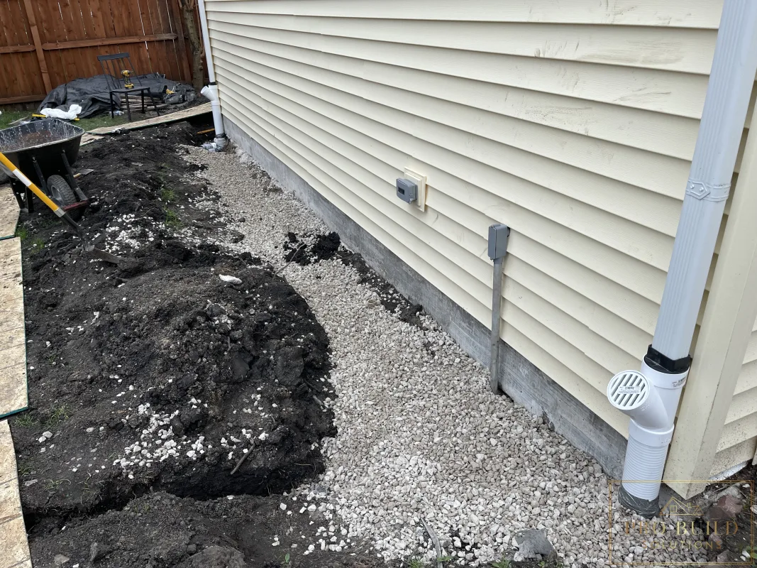 Garage foundation drainage system with gravel and French drain installation, Wood Dale, IL