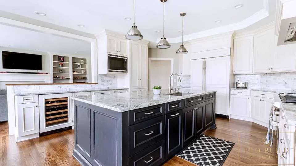 Traditional white kitchen with dark wood island, marble countertops, custom cabinetry, and built-in wine storage, Arlington Heights