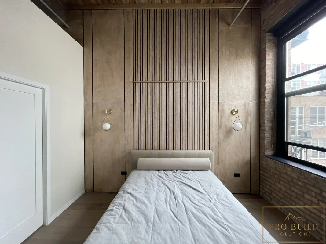 Interior feature wall with natural wood panels, vertical slat design, and modern accent lighting, Carol Stream, IL