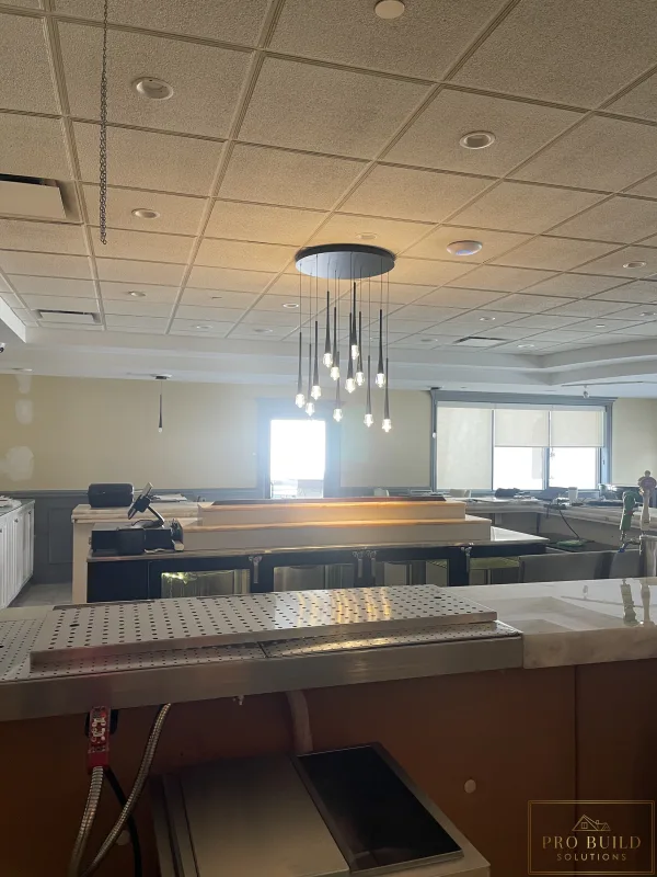 Decorative bar pendant lighting installed during commercial electrical upgrade, Schaumburg, IL