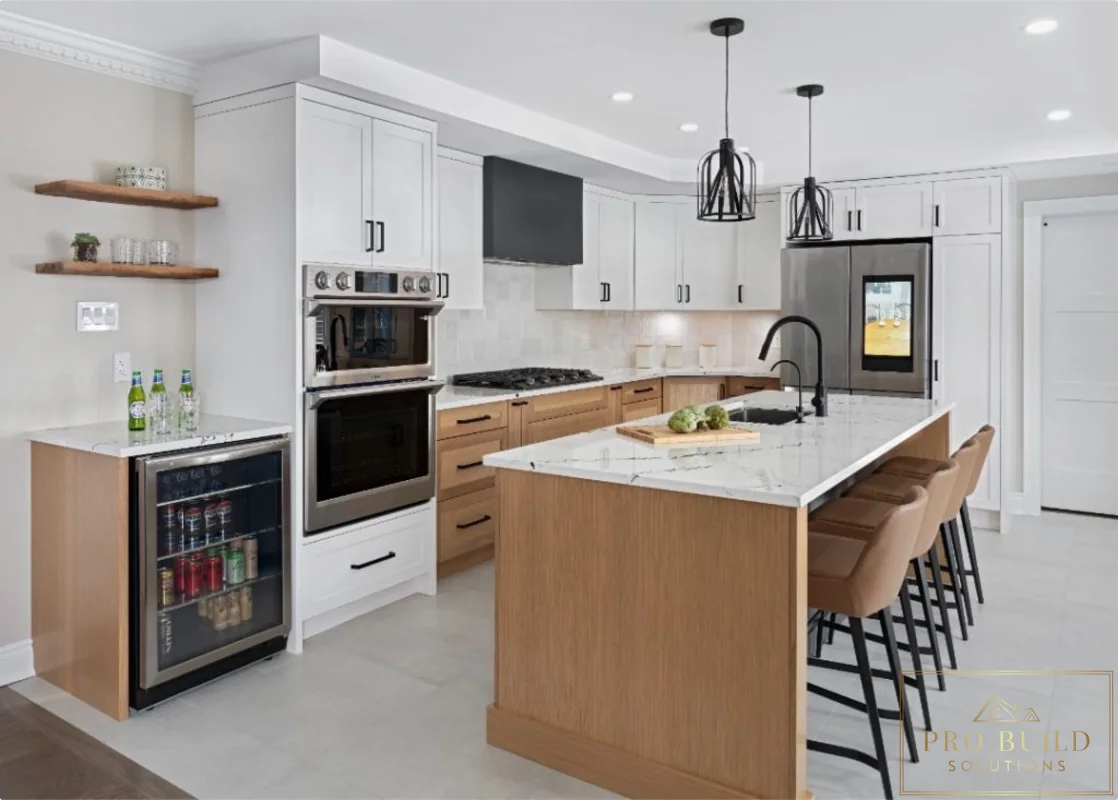Spacious kitchen remodel with white perimeter cabinetry, warm wood island, built-in beverage fridge, and waterfall-style seating area, Carol Stream