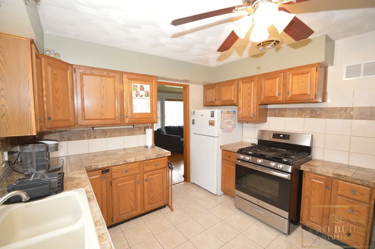 Popcorn Ceiling, Closest Kitchen with pocketdoor, Outdated Fridge and Cabinets, La Grange