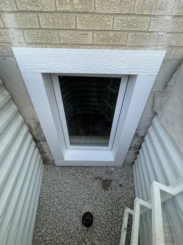 24"w * 48"h Window with White LP Trimming in the Egress Window Well, Elmhurst, IL