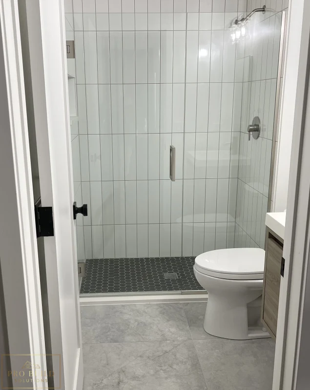 Updated bathroom design with walk-in shower, modern tile work, and clean neutral finishes, Claredon Hills