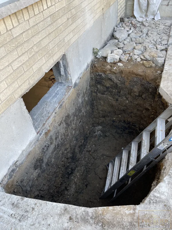 Egress  window depth to the bottom of the foundation to setup for proper drainage., Elmhurst, IL