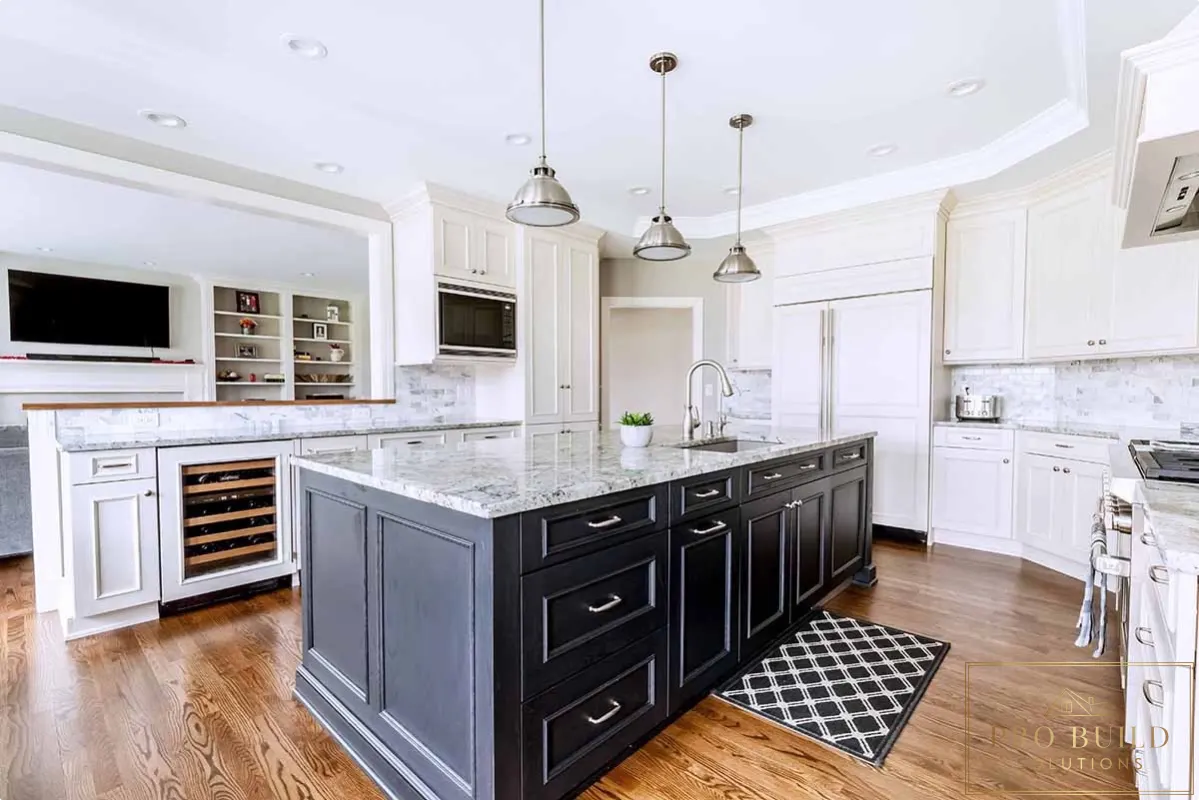 Traditional white kitchen with dark wood island, marble countertops, custom cabinetry, and built-in wine storage, Arlington Heights