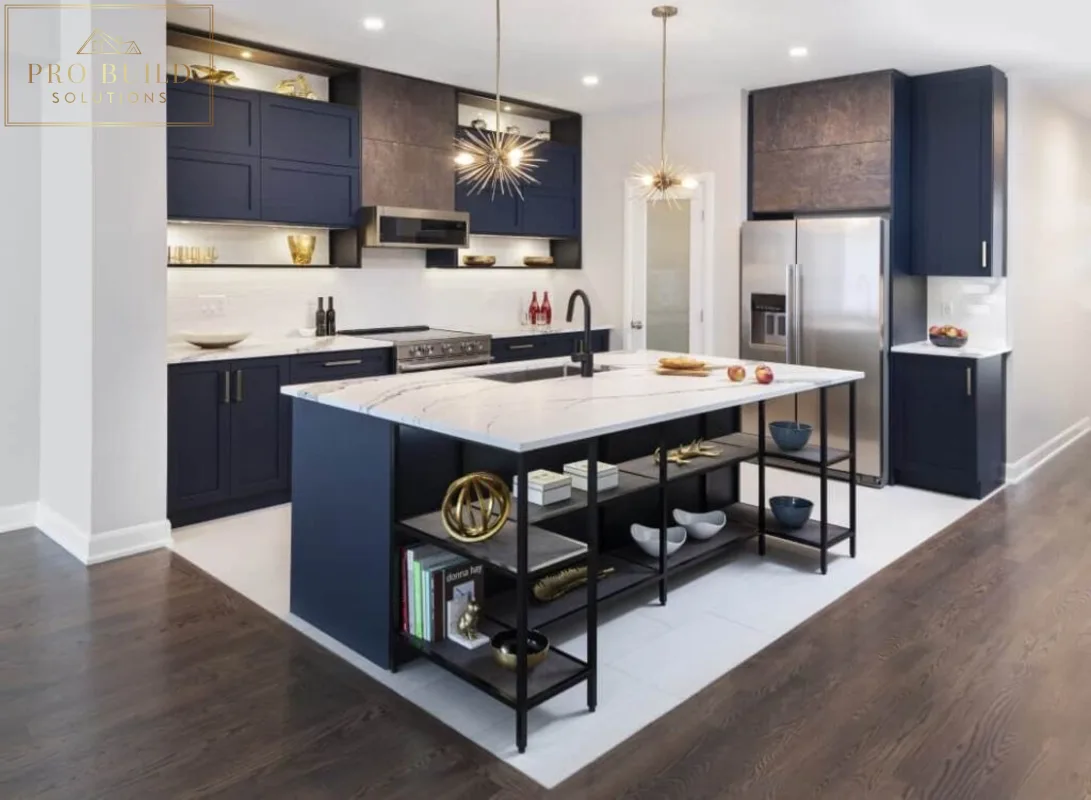 Contemporary kitchen featuring dark blue cabinetry, white quartz island, stainless appliances, and sleek black shelving accents, Darien, IL