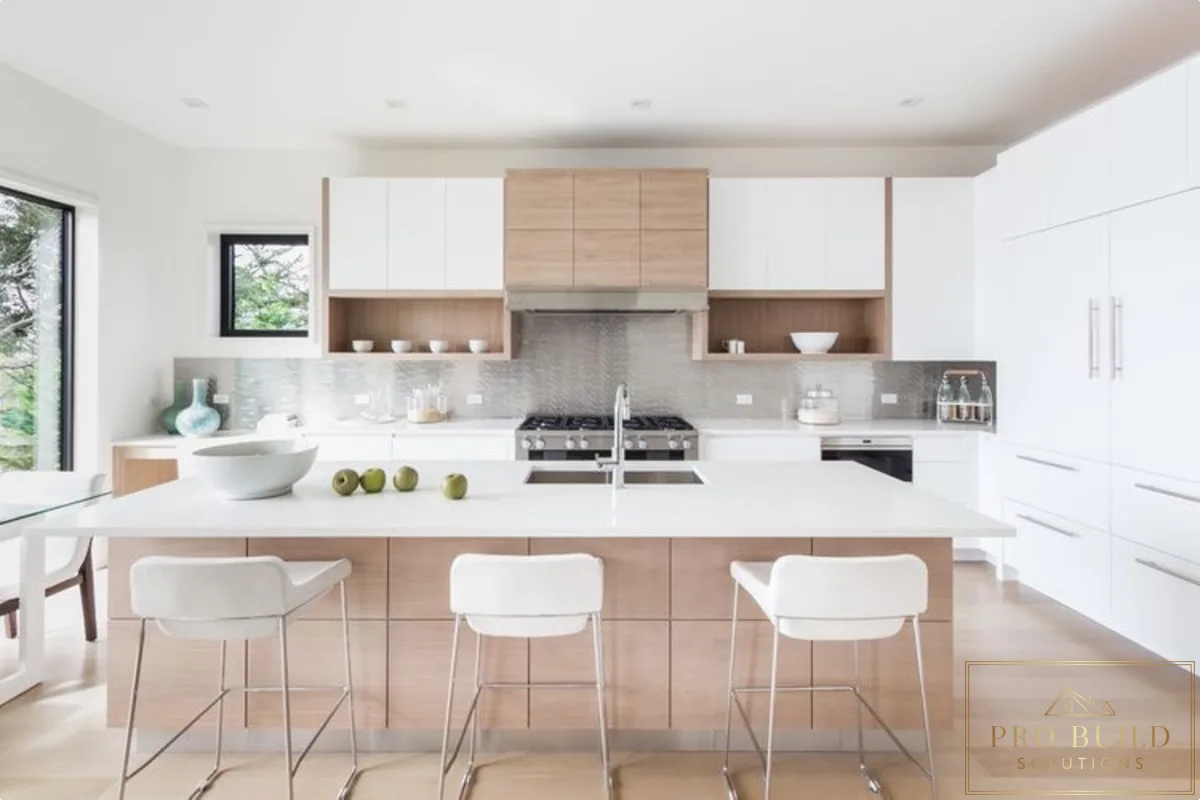 Contemporary modern kitchen featuring mixed white and natural wood cabinetry, oversized island sink, and clean linear design, Burr Ridge, IL