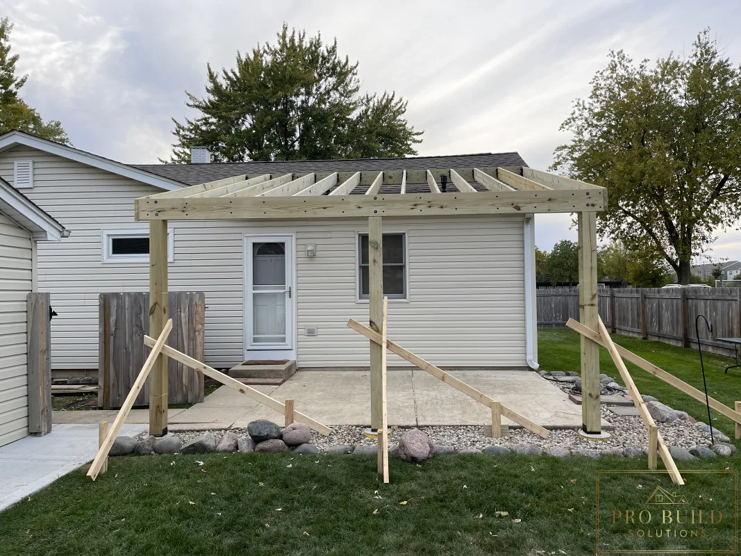 Pressure-treated pergola framing with raised SkyLift roof connection in Rolling Meadows, Illinois