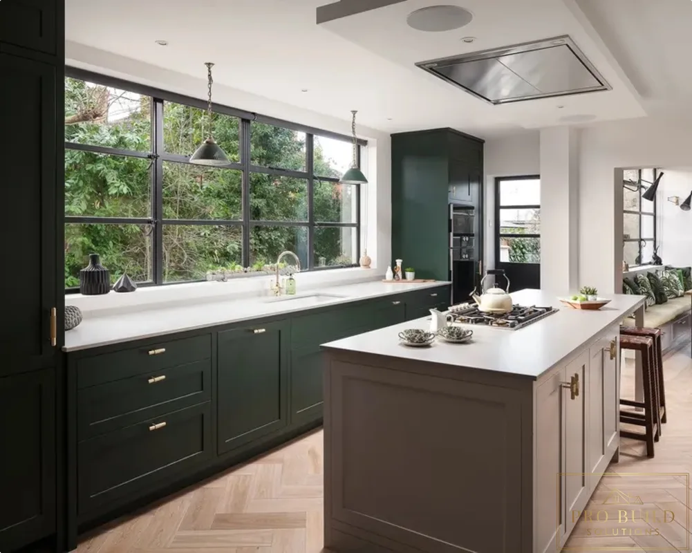 Dark green kitchen with large island, white countertops, black-framed windows, and herringbone wood flooring, Glenview, IL