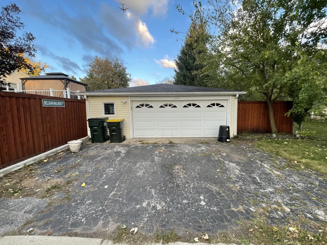 Detached garage rebuild before photo with old driveway and existing garage, Wood Dale