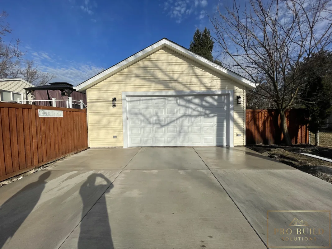Detached garage rebuild after photo with new foundation, siding, and driveway, Wood Dale