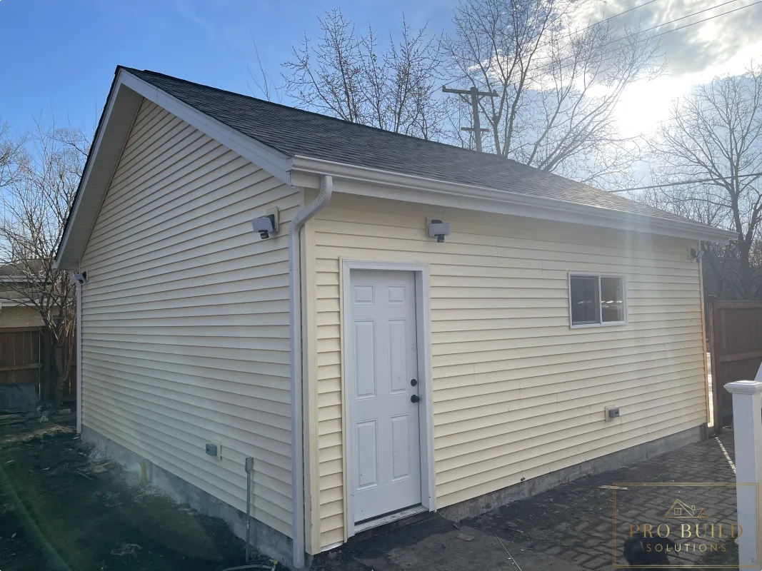 Completed garage side elevation after rebuild with updated exterior finishes, Wood Dale