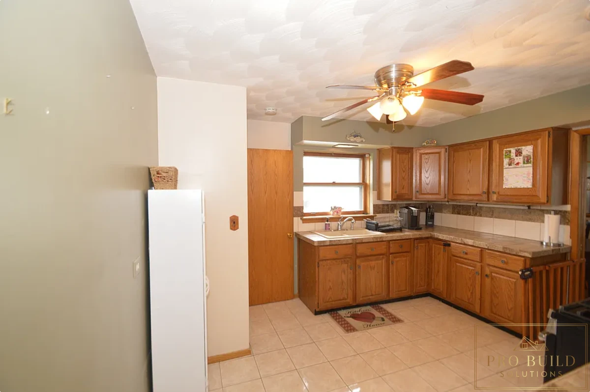 12*12 Ceramic Flooring, Ceramic Countertop, Nickel Faucet, Porcelain Sink, Closed Kitchen Concept, Popcorn Ceiling, La Grange