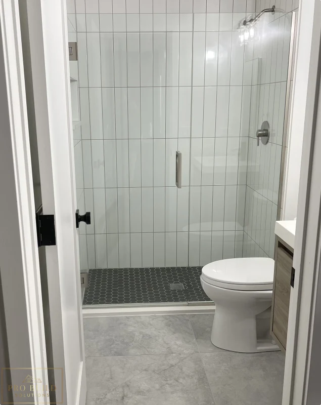 Updated bathroom design with walk-in shower, modern tile work, and clean neutral finishes, Claredon Hills