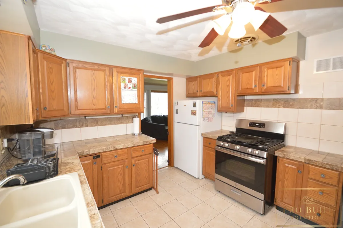 Popcorn Ceiling, Closest Kitchen with pocketdoor, Outdated Fridge and Cabinets, La Grange