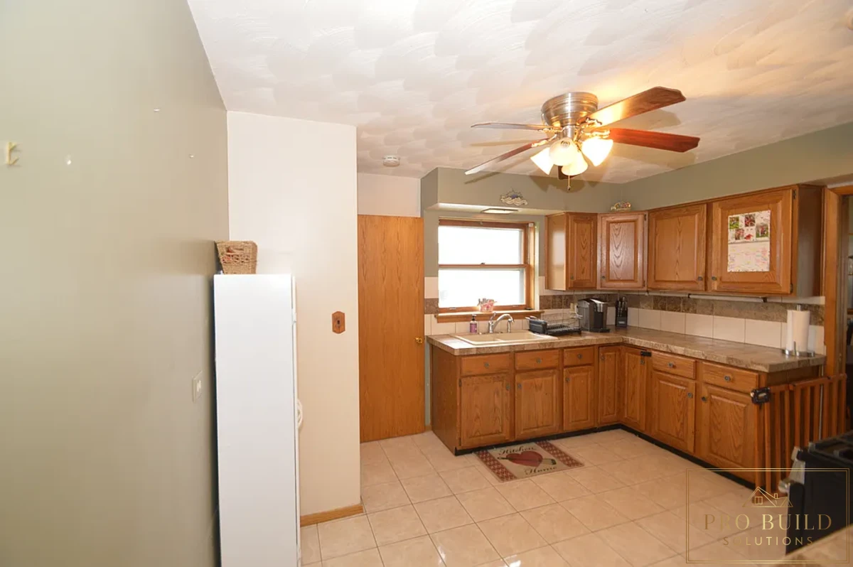 12*12 Ceramic Flooring, Ceramic Countertop, Nickel Faucet, Porcelain Sink, Closed Kitchen Concept, Popcorn Ceiling, La Grange