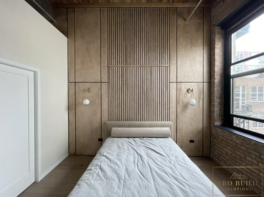 Interior feature wall with natural wood panels, vertical slat design, and modern accent lighting, Carol Stream, IL