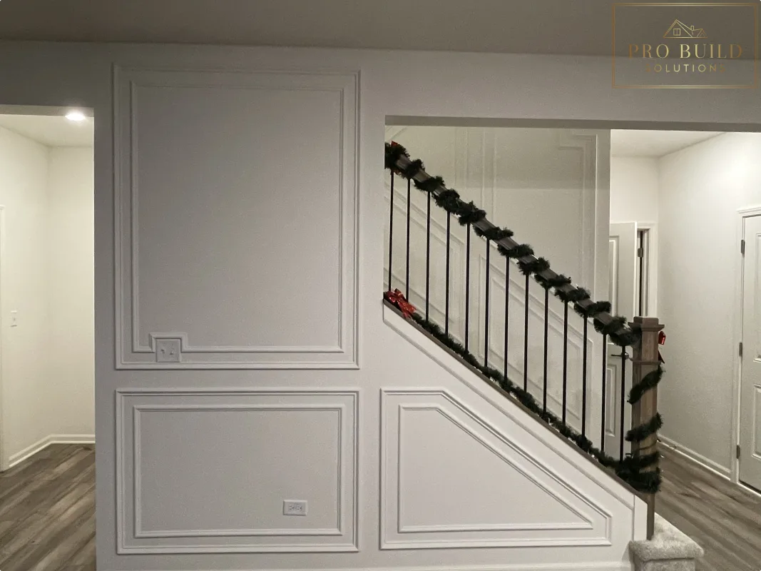 Custom interior trim work with picture frame wall molding and clean white finish, Plainfield, IL