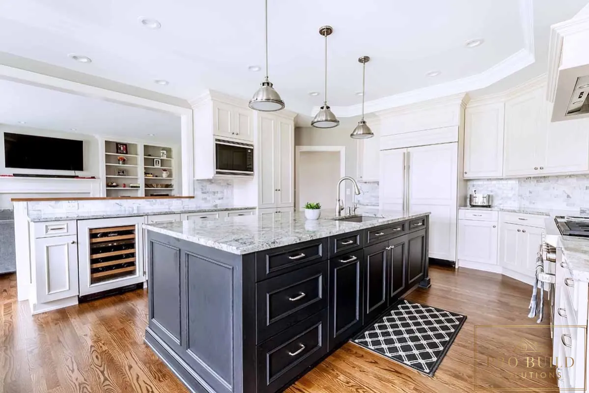 Traditional white kitchen with dark wood island, marble countertops, custom cabinetry, and built-in wine storage, Arlington Heights