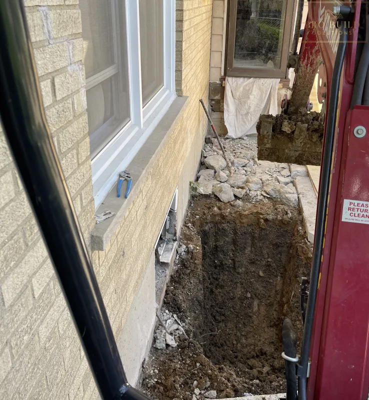 Egress Window area being dug out with excavator, Elmhurst, IL