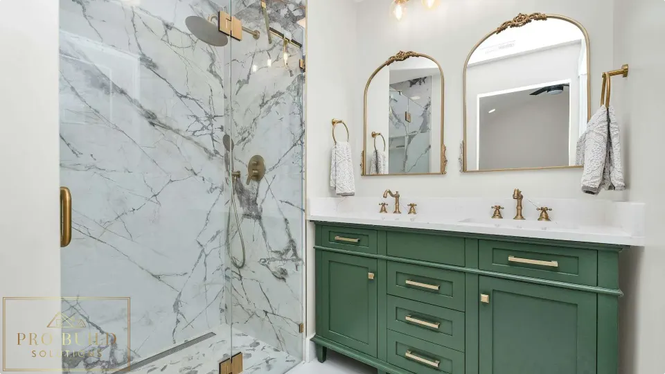 Elegant traditional bathroom design featuring a custom green vanity, frameless marble shower, and warm brass hardware, Elmhurst, IL