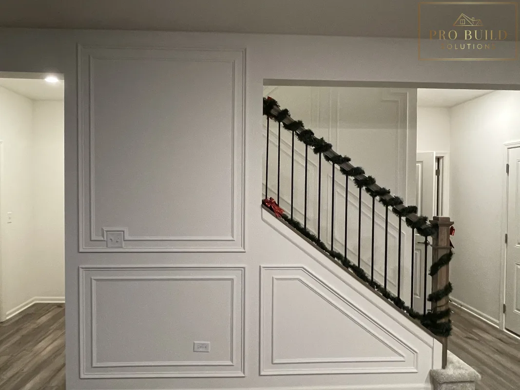 Custom interior trim work with picture frame wall molding and clean white finish, Plainfield, IL