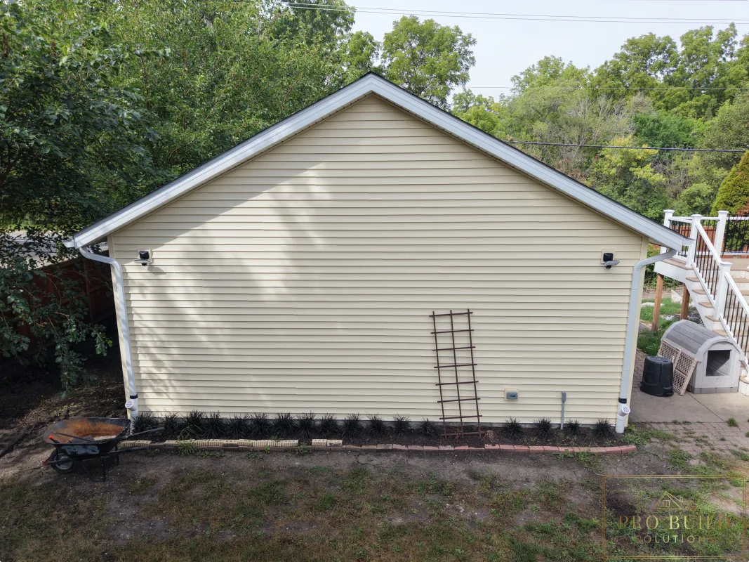 Finished garage exterior with new gutters, siding, and lighting, Wood Dale, IL