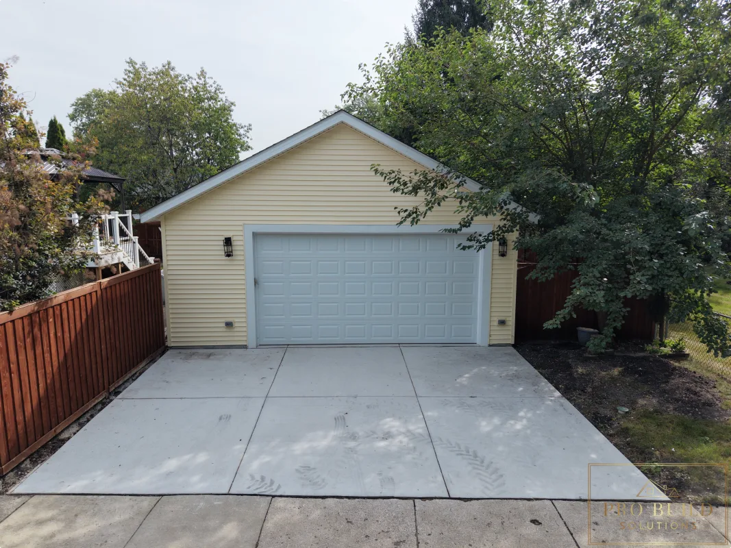 Detached garage rebuild after photo with new foundation, siding, and driveway, Wood Dale